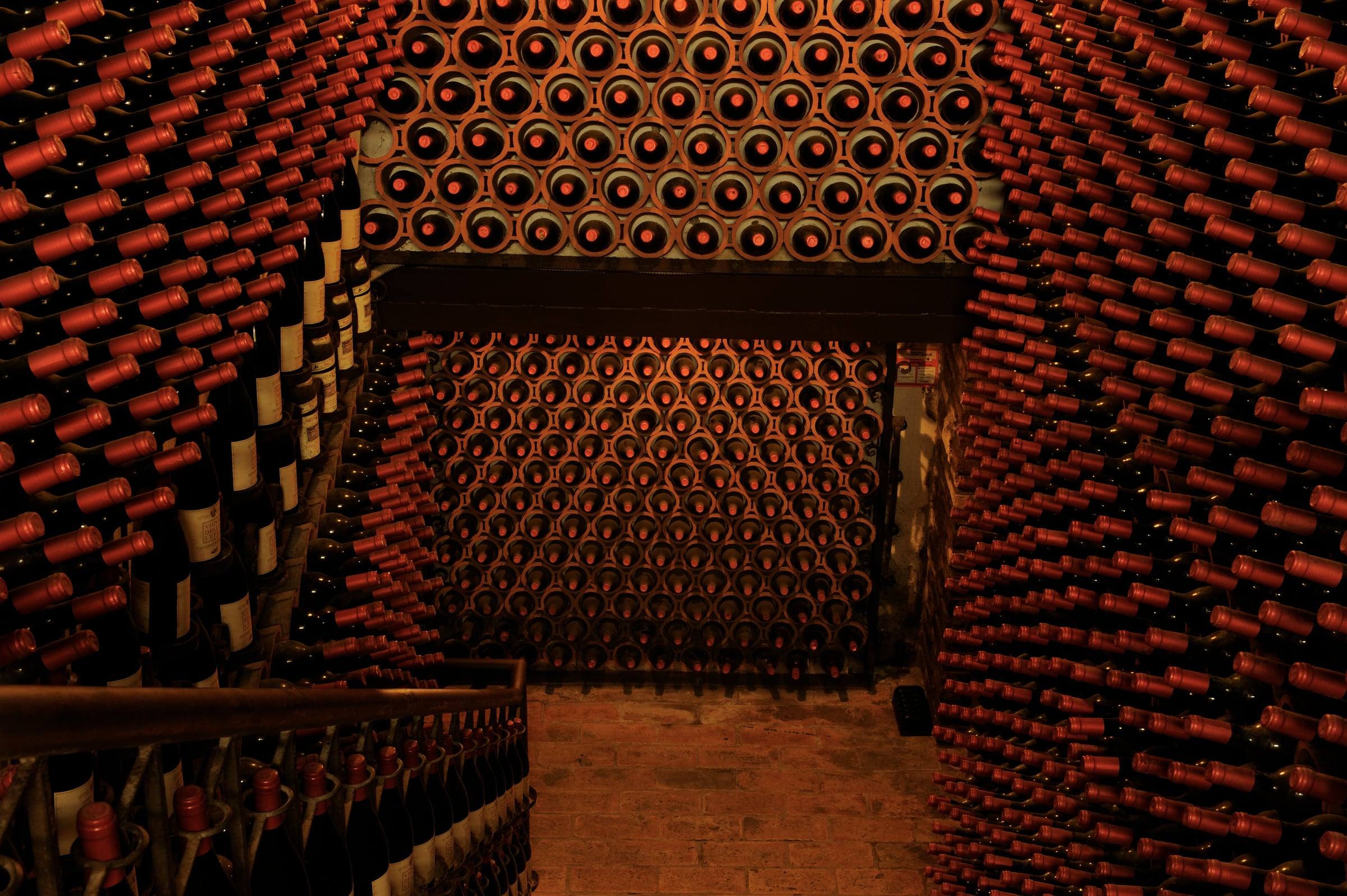 Archive room with walls of red-capped bottles